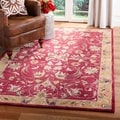 Handmade Hereditary Burgundy/ Gold Wool Rug (6' x 9')
