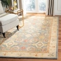 Handmade Legacy Light Blue Wool Rug (6' x 9')