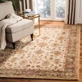 Handmade Heirloom Ivory/ Light Green Wool Rug (9' x 12')