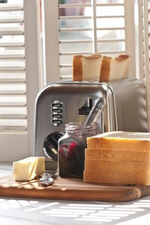 Stainless-steel toaster with bread and jam