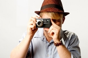 Hipster guy taking photos