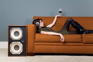 Girl listening to her home audio headphones