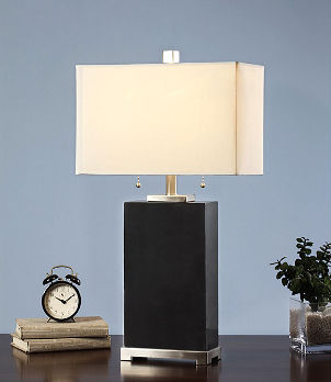 Black contemporary lamp with cream-colored lamp shade