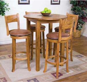 Wooden bar table with wooden bar stools in a room on a rug with bowl of green apples