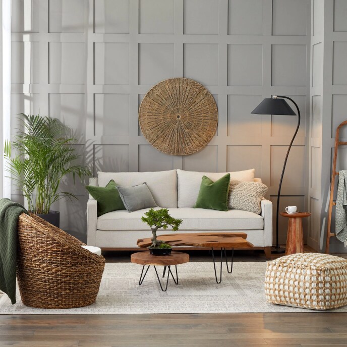 Coastal living room with beige sofa and modern floor lamp, available at Overstock