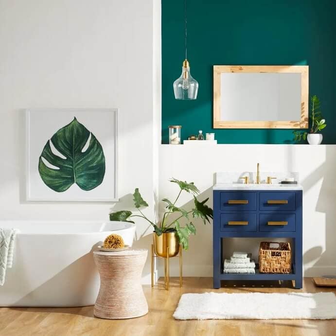 A two tone bathroom designed with eloquent blue single vanity, a white free standing tub and many other wall décor items. Shop at Overstock.com today.